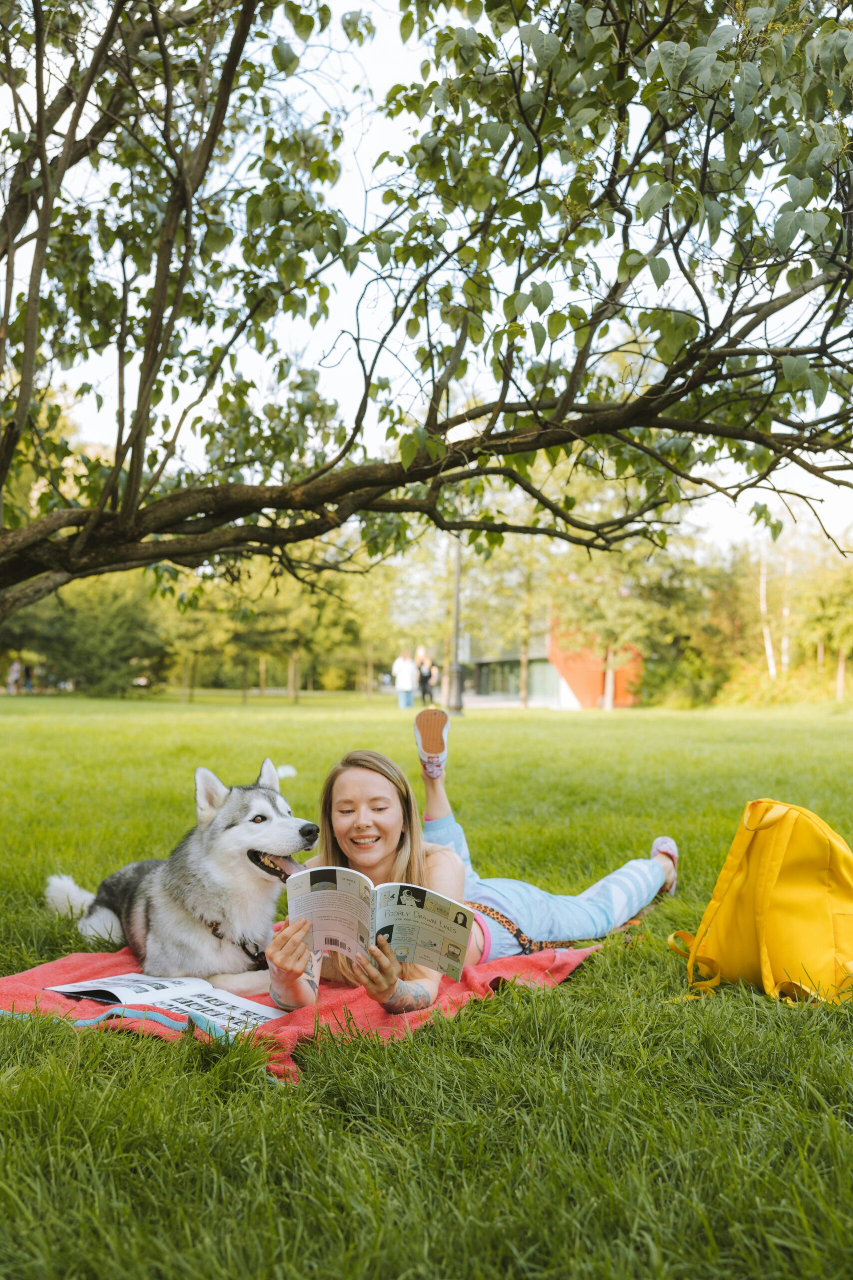 girl studying park dog